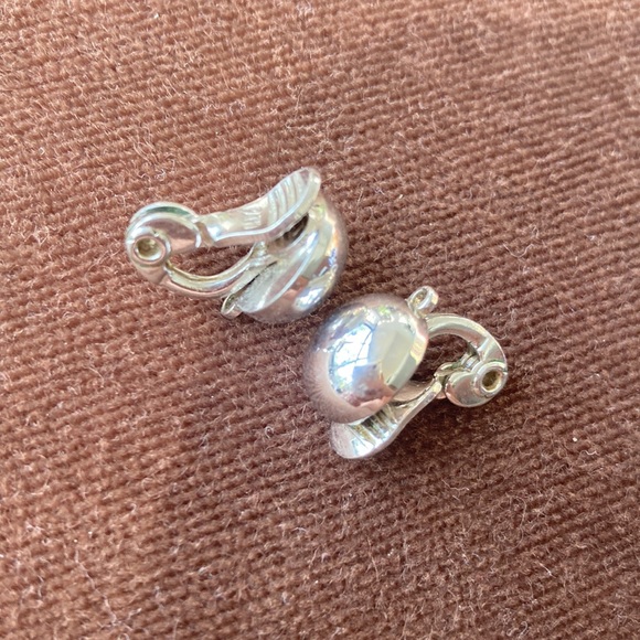 Monet signed small dome clip earrings. Bright shiny chrome. Also marked Patd - Picture 2 of 4